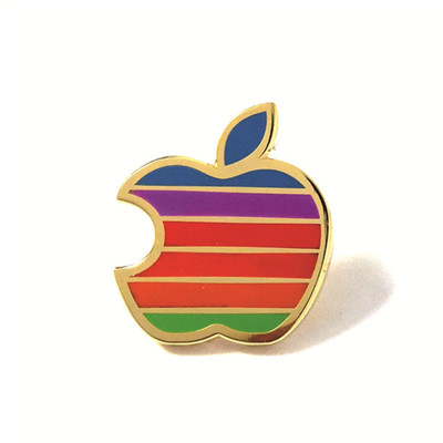 apple design brass gold metal badge